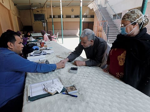 Egyptian pensioners collect their monthly pension in a school as Egypt ramps up efforts to slow the spread of coronavirus disease (COVID-19), at Shubra El Kheima in Al Qalyubia, Egypt, April 7, 2020. REUTERS/Mohamed Abd El Ghany