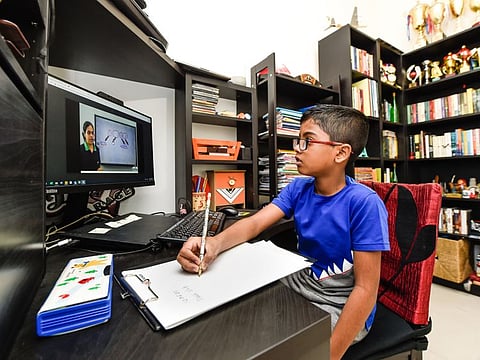 Aadhav Mohan, a grade 4 student of Indian High school, in an e-learning session at home