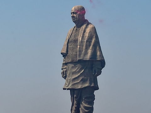 A flower shower by Air Charter on the Statue of Unity, in Kevadiya colony of Narmada district in this file picture from 2018.