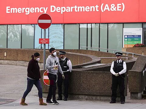 Police officers are seen outside St Thomas' Hospital after British Prime Minister Boris Johnson spent a second night in intensive care after his coronavirus (COVID-19) symptoms worsened on Monday, in London on April 8, 2020.