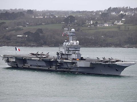 The French aircraft carrier Charles de Gaulle arrives in the port of Brest, in western France on March 13, 2020. The French Army ministry announced on April 8, 2020 that nearly 40 sailors onboard the French aircraft carrier Charles de Gaulle show alleged symptoms of COVID-19. The aircraft carrier Charles de Gaulle currently in the Atlantic ocean was set to arrive in Toulon, southern France, on April 23.