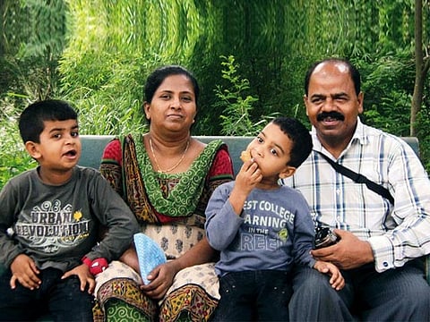 Paramesvarans with sons Shamaya and Nichaya, born after the disaster.