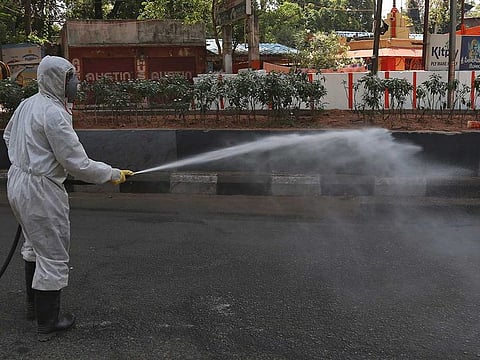 A National Disaster Response Force soldier disinfects an area during lockdown to prevent the spread of new coronavirus in Hyderabad, India.