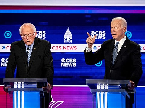 Sen. Bernie Sanders and former Vice-President Joe Biden during the Democratic presidential debate at the Gaillard Center in Charleston, S.C., on Feb. 25, 2020. Having become the presumptive Democratic presidential nominee, Biden and his allies are aiming to win over Sanders’s younger, more liberal voters and unify the party.
