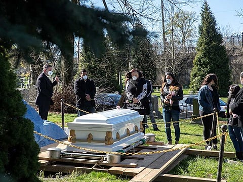 Mourners attend a funeral at The Green-Wood Cemetery during the outbreak of the coronavirus disease (COVID-19) in the Brooklyn borough of New York City, New York, U.S.