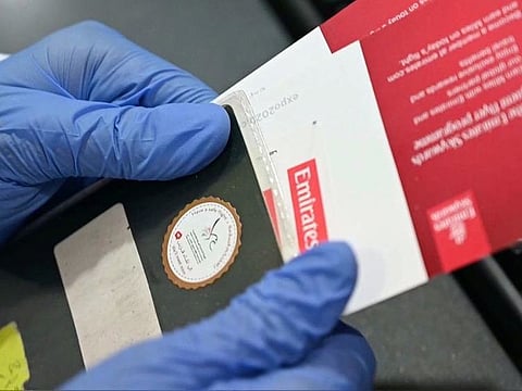 People stranded in Dubai who have left to return to their home countries have received a special sticker on their passport.