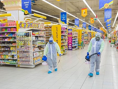 Disinfection drive against COVID-19 under way at a supermarket.