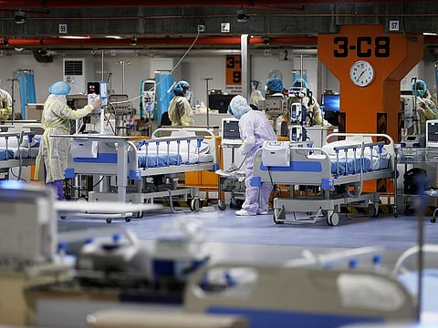 Doctors and nurses are seen doing their final check on the equipment in a makeshift ICU "Field Intensive Care Unit 1" set up by Bahrian authorities to treat the coronavirus disease (COVID-19) critical patients, at a car-park of Bahrain Defence Force Hospital in Riffa, Bahrain, April 14, 2020.