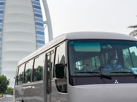 Driver with mask in Dubai.