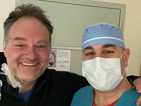 In an undated handout image, Dr Ryan Padgett, left, with Dr. Samuel Youssef, one of the doctors who treated him while he was sick with the coronavirus. Padgett, 45, had rarely missed a day of work to illness — then the coronavirus took him to the brink of death. (Handout via The New York Times)