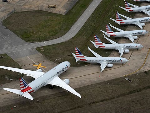 American Airlines passenger plane (L) parked due to flight reductions made to slow the spread of coronavirus disease (COVID-19), at Tulsa International Airport in Tulsa, Oklahoma, U.S. March 23, 2020.