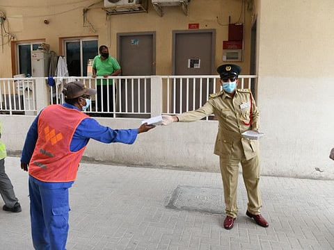 Dubai Police supply labourers with food baskets