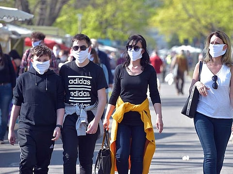 Visitors of a weekly market wear protective masks, as the fight against the coronavirus disease (COVID-19) continues in Dresden, Germany, April 17, 2020.