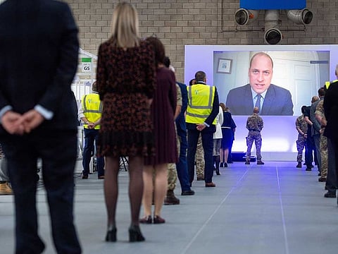 Britain's Prince William speaks via videolink as he officially opens the NHS Nightingale Hospital Birmingham, in the National Exhibition Centre (NEC), England, Thursday April 16, 2020. The NHS Nightingale Hospitals have been built to provide extra beds for patients with coronavirus symptom as the UK continues in lockdown to help curb the spread of the disease.