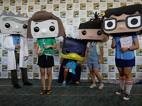 FILE PHOTO: Attendees pose for a picture as they arrive in costumes to enjoy Comic Con International in San Diego, California, U.S., July 19, 2019. REUTERS/Mike Blake/File Photo