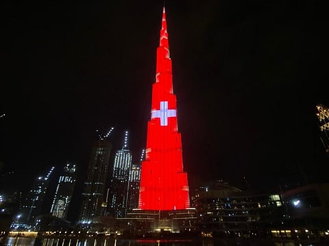 Dubai’s Burj Khalifa lights up in colours of the Swiss flag as a thank you to Switzerland for projecting the UAE flag on the Matterhorn mountain in Switzerland.