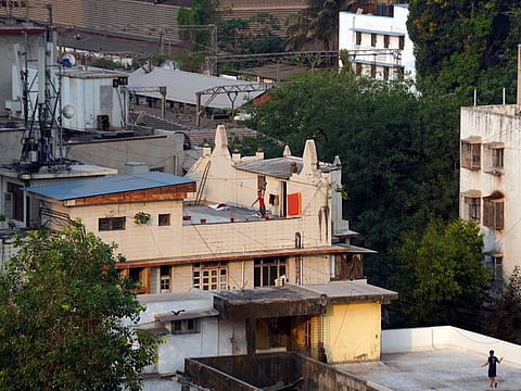 A man lifts weights while working out on the rooftop of his house during an extended nationwide lockdown to slow the spreading of the coronavirus disease in Mumbai, April 19.