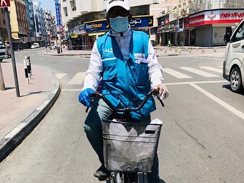 Abdul Razzak, a salesman volunteering to deliver food packets