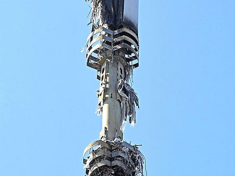 In this Tuesday, April 14, 2020 photo, a view of a cell tower after a fire, in Dagenham, England.
