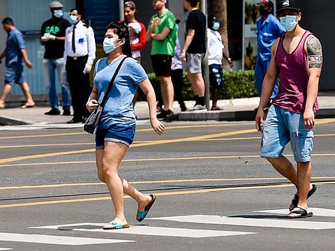 Filipino expats wearing masks in Deira, Dubai . Photo: Virendra Saklani/Gulf News