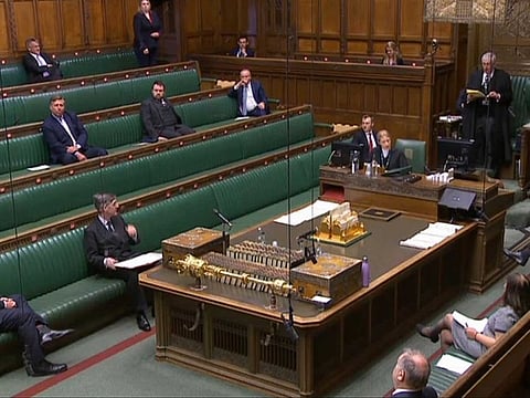 A video grab from footage broadcast by the UK Parliament's Parliamentary Recording Unit (PRU) shows Members of Parliament sitting in the Chamber in the House of Commons, in London on April 21, 2020, where social distancing measures have been put in place due to the novel coronavirus COVID-19 pandemic.