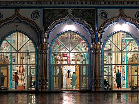 Muslim worshippers attend evening prayers after ending their fast on the first day of Ramadan in Rawalpindi, Pakistan, on April 25, 2020.