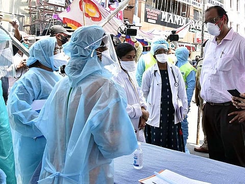 Central COVID-19 team members interacting with the GHMC health team during their inspection at containment zone area, Fakheer Galli Old Malakpet, in Hyderabad on Sunday.