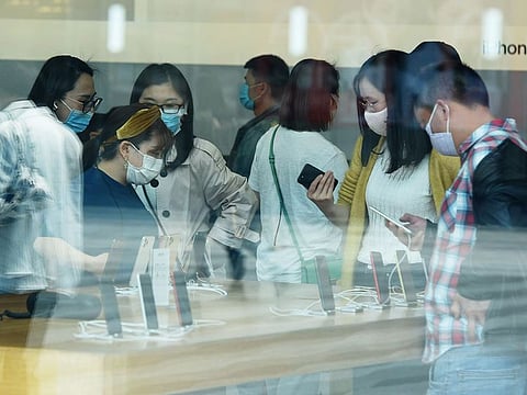 Customers inside an Apple store.