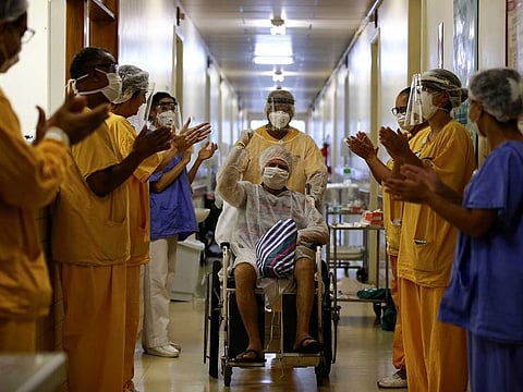 Lauro Riff Viegas, 69, gestures as he leaves the Nossa Senhora da Conceicao Hospital, after being treated for the coronavirus disease (COVID-19) and discharged, in Porto Alegre, Brazil, April 27, 2020.