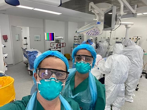 Hospital staff get ready for surgery of COVID-19 positive patients at Rashid Hospital