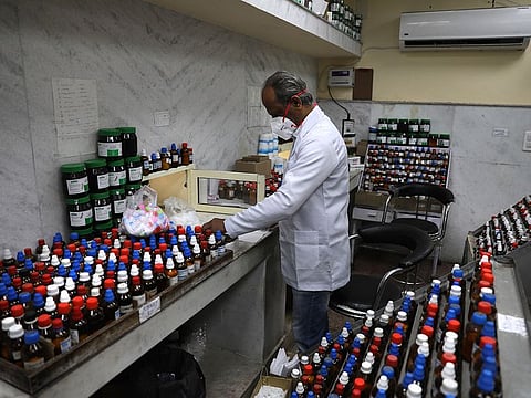 A doctor makes homeopathic pills in New Delhi, India.