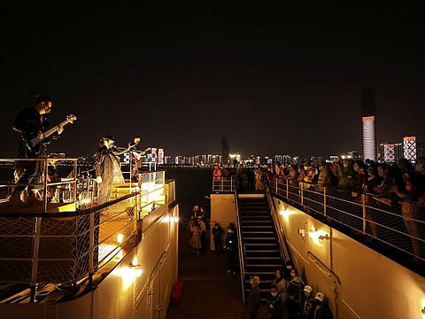 Performers wearing face masks take part in a charity show on a ship to pay tribute to medical workers in Wuhan, the Chinese city hit hardest by the coronavirus disease (COVID-19) outbreak, in China's Hubei province April 27, 2020.