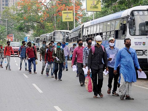 Migrant labourers being sent back to their homes by West Bengal government during the nationwide lockdown to curb the spread of coronavirus, in Kolkata on Wednesday.
