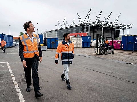 Dutch Prime Minister Mark Rutte (L) visits the facility of the Hague Environmental Services, a waste company, on April 29, 2020 in The Hague, amid the COVID-19 outbreak caused by the novel coronavirus.
