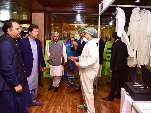 COVID-19 crisis has provided Pakistan an opportunity to locally manufacture key medical equipment, said PM Imran Khan as he visits the exhibition of medical gear in Islamabad. Image Credit - PID