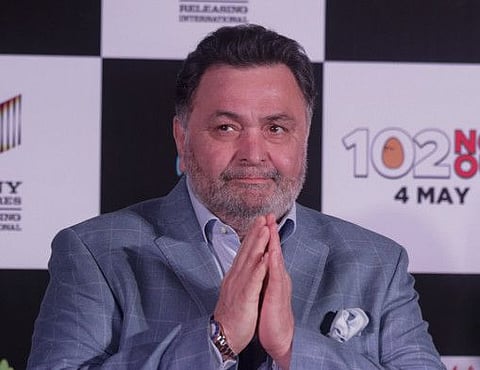 Bollywood actor Rishi Kapoor greets media as he arrives for the song launch of film '102 Not Out' in Mumbai, India, Thursday, April 19, 2018. The film is scheduled for worldwide release on 4 May 2018. (AP Photo/Rafiq Maqbool)