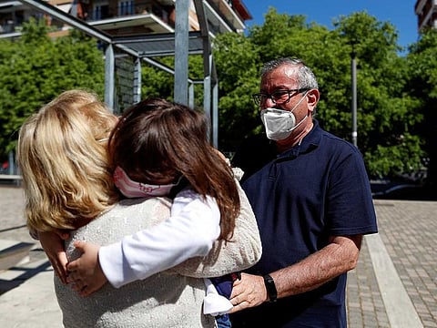 Domenico di Massa and Mariantonia Gangemi embrace their granddaughter Cecilia for the first time in two months after Italy allowed families to see each other again as the country begins a staged end to a nationwide lockdown due to a spread of the coronavirus disease (COVID-19), in Rome, Italy, May 4, 2020.