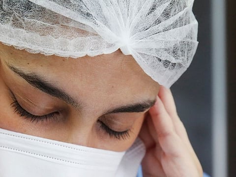 Doctor Meryem Bouchbika wearing a protective face mask takes a break at her office at Prince Moulay Abdellah hospital as the spread of the coronavirus disease (COVID-19) continues in Sale, Morocco