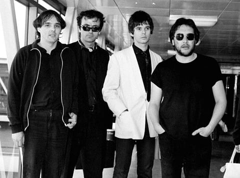 In this July 6, 1980 file photo, from left, Dave Greenfield, Hugh Cornwell, Jean-Jacques Burnel and Jet Black of the group The Stranglers pose for a photo. Dave Greenfield, the keyboard player with British punk band The Stranglers and who penned the music to their biggest hit Golden Brown, has died after testing positive for coronavirus. He was 71. The band's official website announced that Greenfield died on Sunday, May 3, 2020 after contracting the virus following a stay in hospital for heart problems. (PA via AP, File)