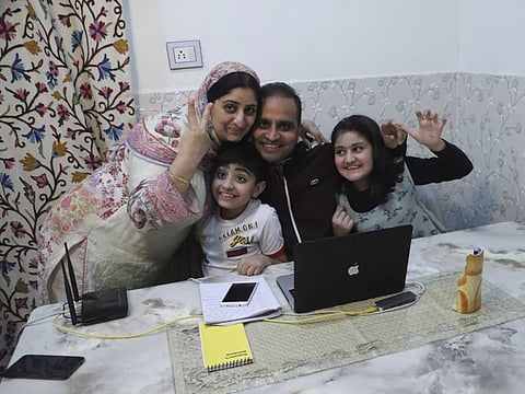 Associated Press photographer Mukhtar Khan celebrates with his family at his home in Srinagar on Tuesday, following the announcement that he was one of three AP photographers who won the Pulitzer Prize in Feature Photography for their coverage of the conflict in Kashmir.