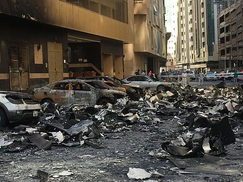 Wreckage below the Abbco Tower in Sharjah after Tuesday's fire