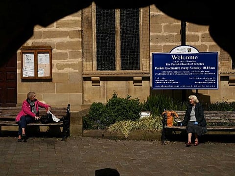 People observe government social distancing guidelines in Pontefract, England.