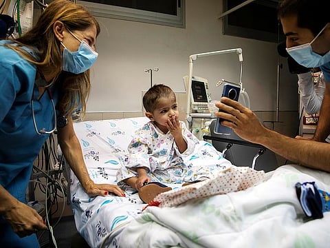 Palestinian boy Hamza Ali Mohammad, 2, who was treated for congenital heart disease at the Wolfson Medical Center in Israel and separated from his family for two months because of the coronavirus disease (COVID-19) lockdown, shown a video call with his mother before he departs to Ramallah to reunite with his family