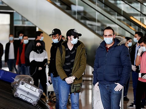 Jordanian students who were studying abroad, wait for their luggage after they returned to their home country amid concerns over the spread of the coronavirus disease (COVID-19), at Queen Alia International Airport, in Amman, Jordan May 6, 2020.