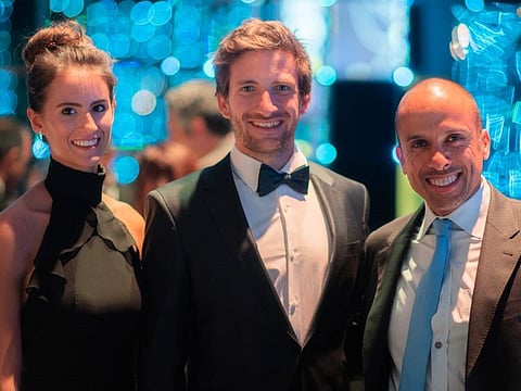 World Champion Kevin Reiterer (centre) is joined by Victory Team chairman Huraiz Bin Huraiz (right) and his longtime girlfriend Laura Ullrich at the 2019 Annual UIM Awards Night in Lausanne
