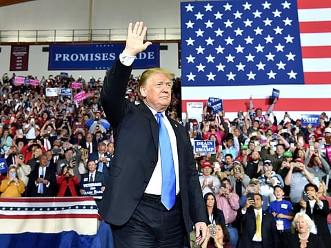 US President Donald Trump arrives for a 'Make America Great Again' rally at Eastern Kentucky University, in Richmond, Kentucky, earlier.