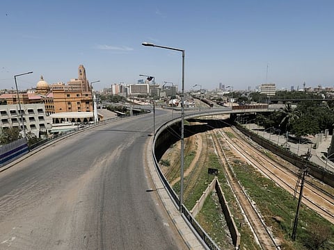 A general view of a deserted road in a business district during a lockdown in an effort to stop the spread of the coronavirus disease (COVID-19), in Karachi on May 8.