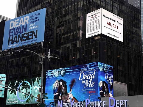 A 56-foot billboard called the "Trump Death Clock" is seen in Times Square in New York City on May 11, 2020.