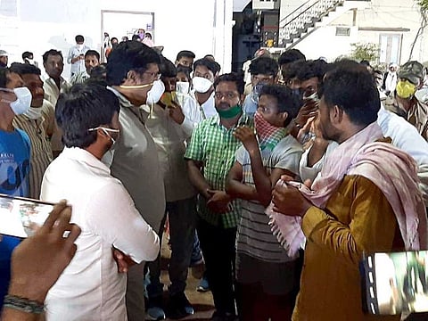 Andhra Pradesh Tourism Minister Muttamsetti Srinuvas Rao meets residents of RR Venkatapuram village as he arrives to spend a night at the village after the gas leak incident in Vishakhapatnam on Tuesday.