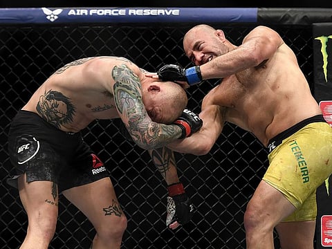 Glover Teixeira of Brazil (right) on his way to victory over Anthony Smith of the United States last year.